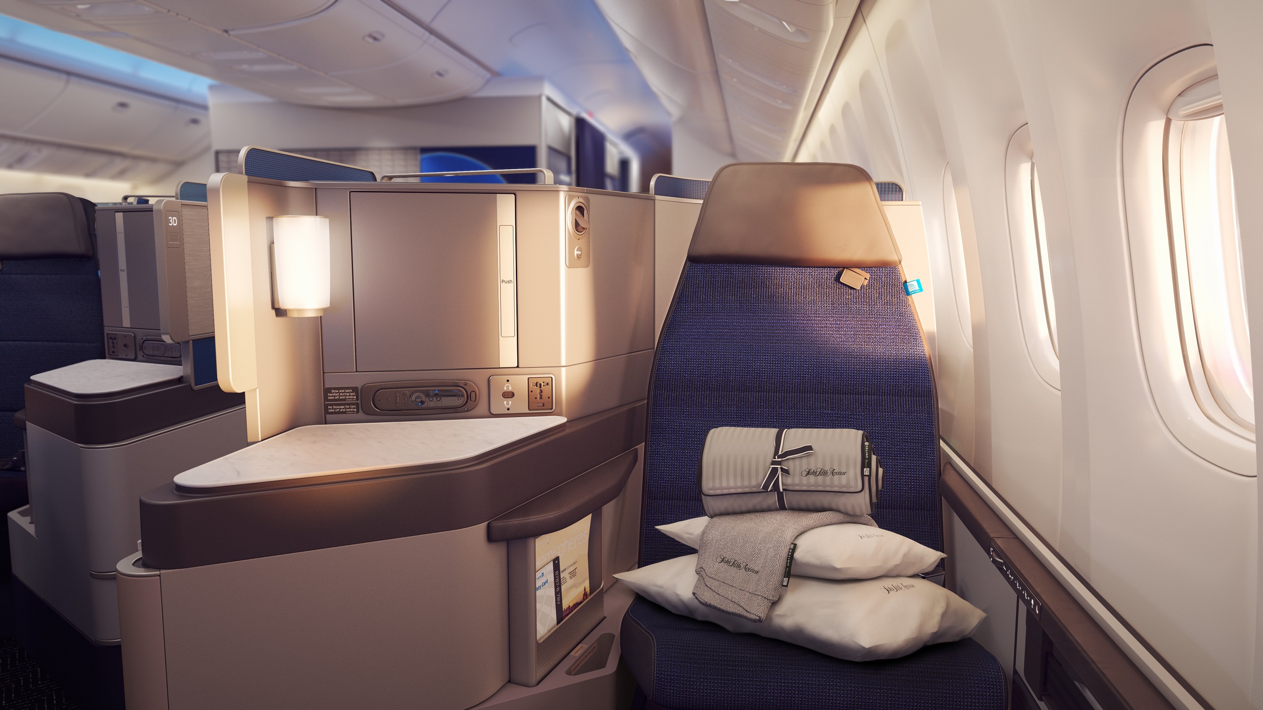 United's Polaris Business class seat with Saks bedding