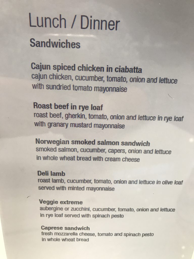 Qatar Airways Business Class Al Mourjan lounge Doha review deli menu