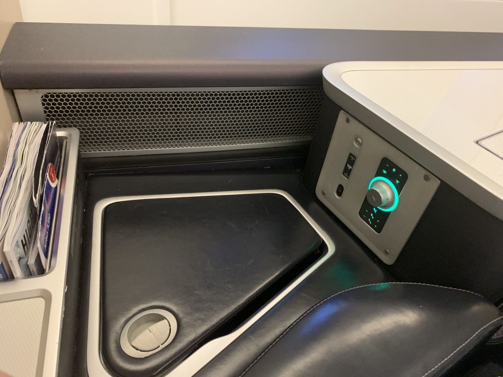 Seat control dial and side bin