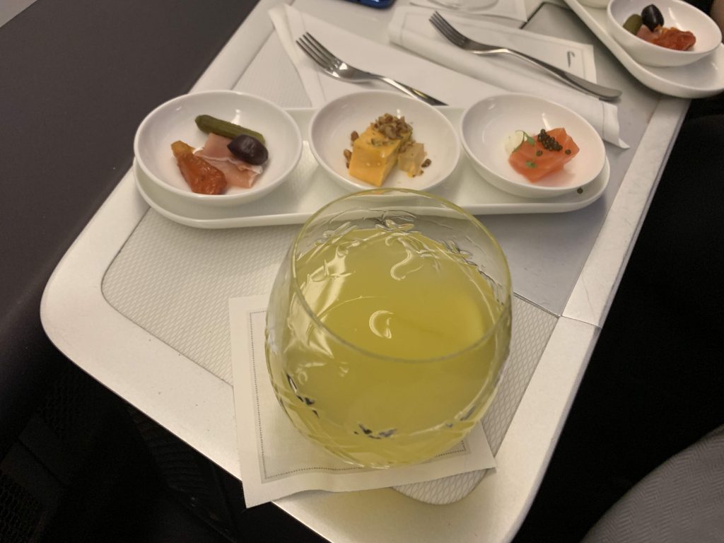 A Gin Zing cocktail and the canapes