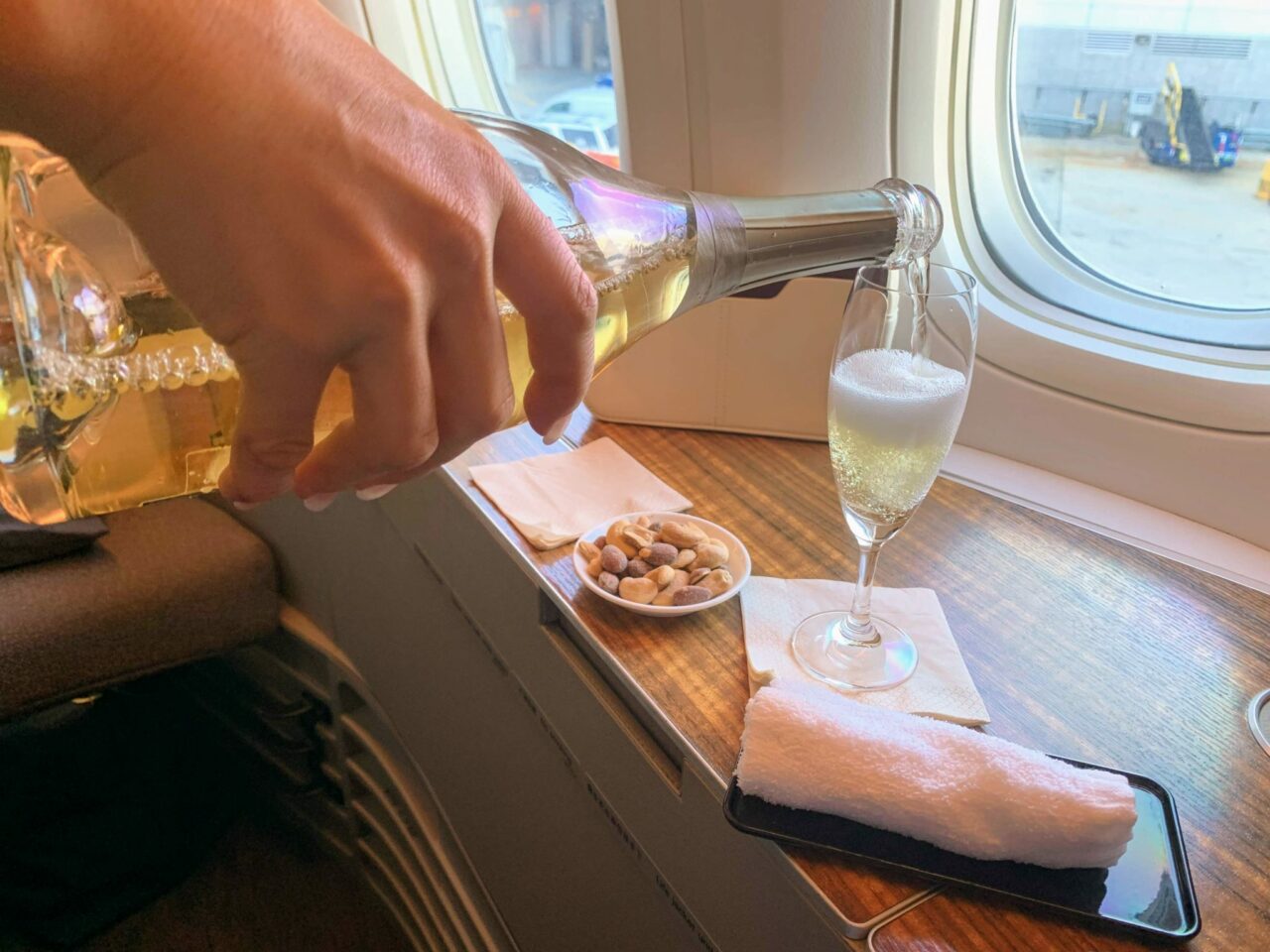 Cathay Pacific First Class pouring of champagne 