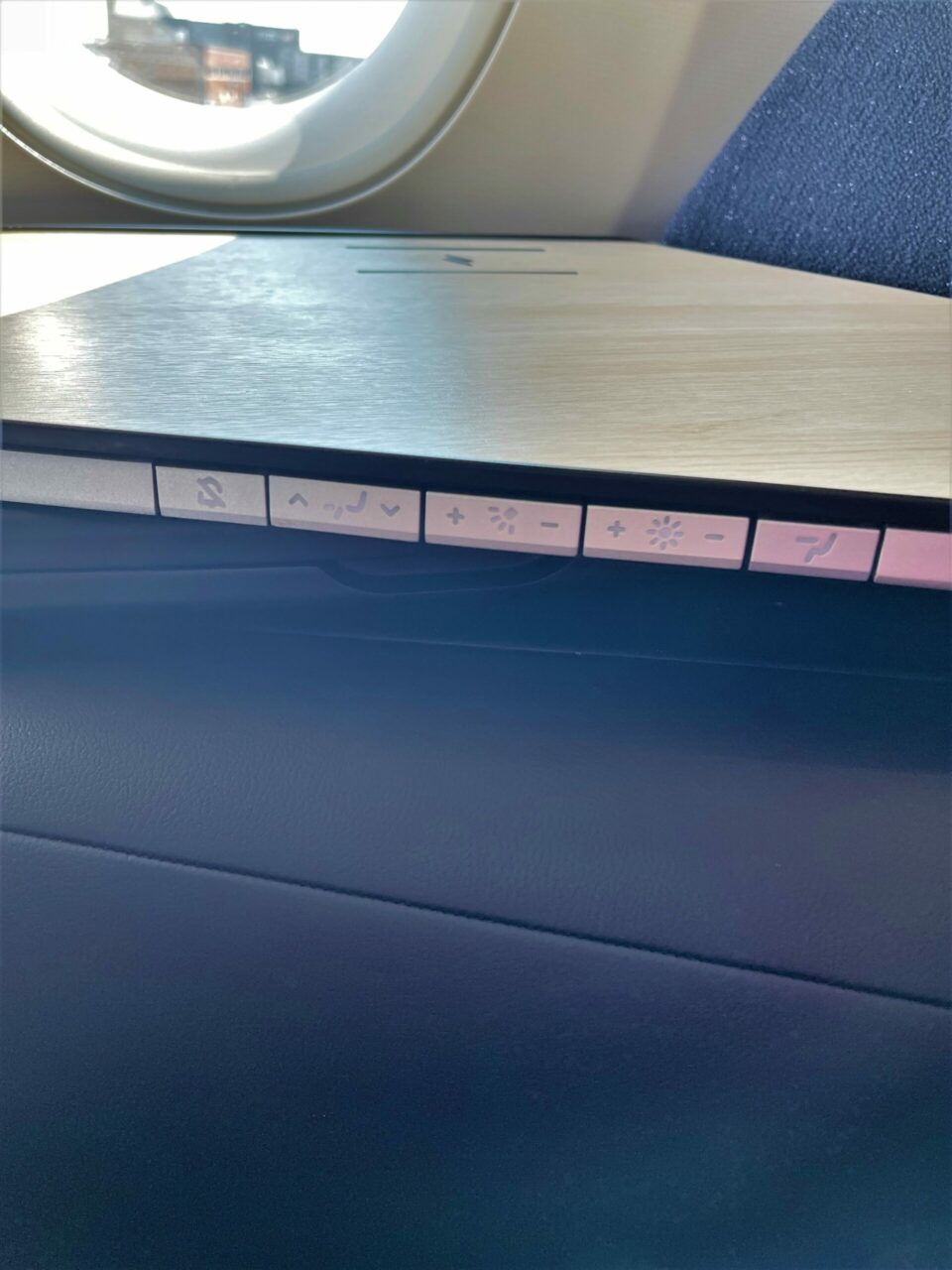 Wireless phone charging buttons in Finnair new A350 non reclining long haul business class