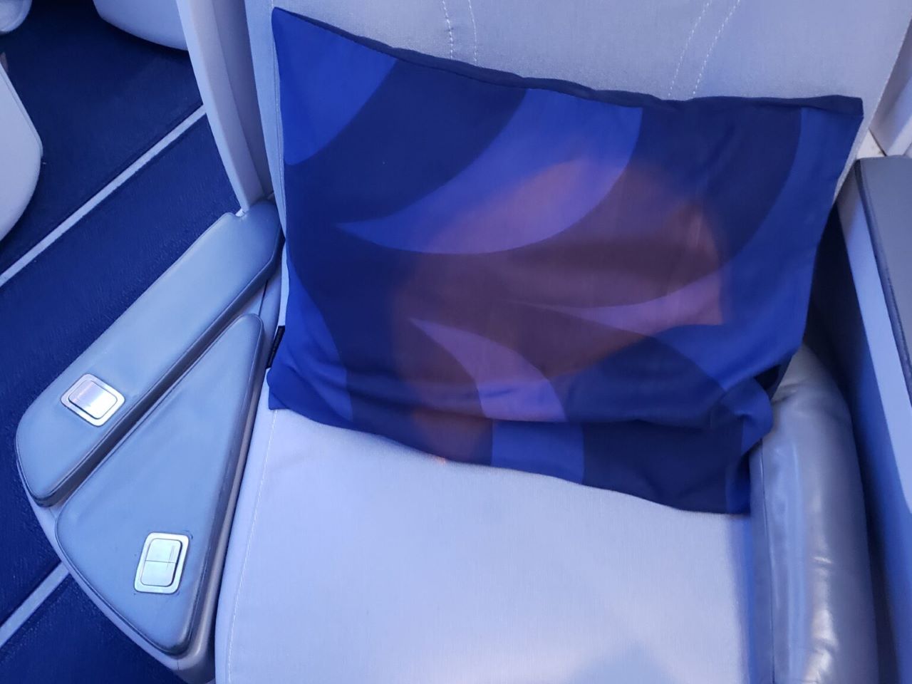 Finnair business class adjustable armrest storage