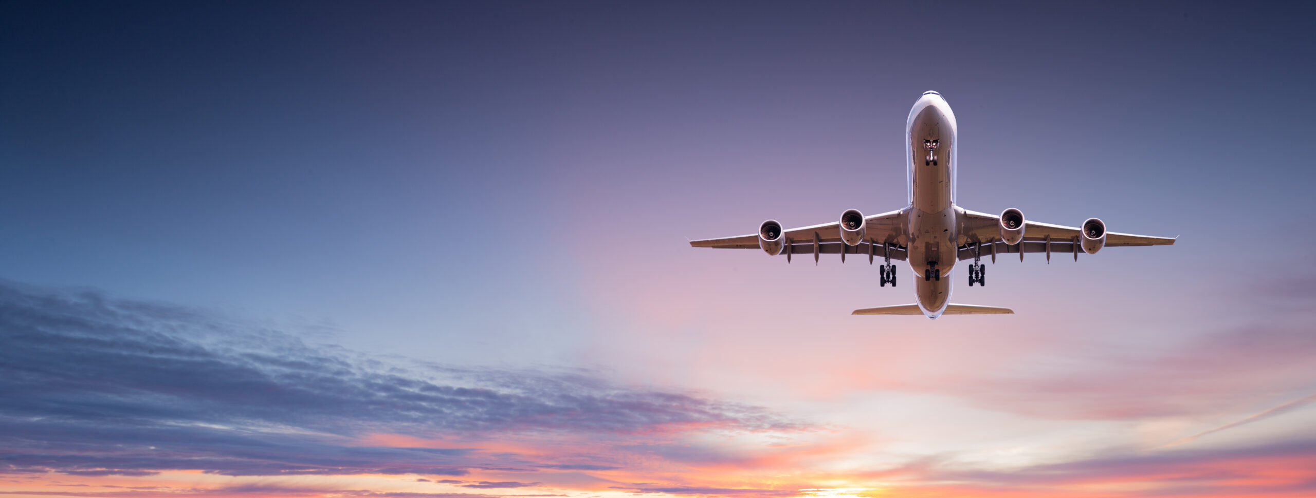 Commercial airplane jetliner flying above dramatic clouds. - Flight reviews