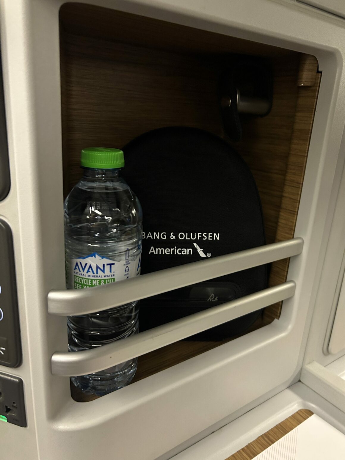American Airlines B777-300ER Business Class water bottle along the seat 