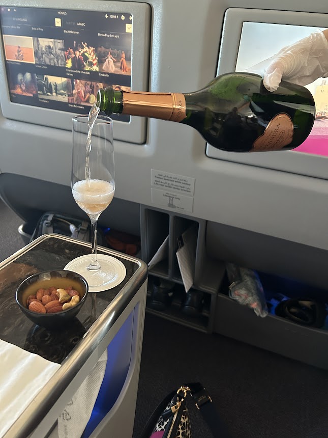 Pouring of champage in Qatar Airways Business Class