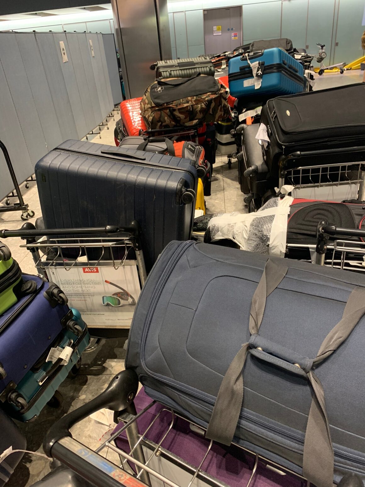 Luggage piled up at Heathrow T5 19 December 2022