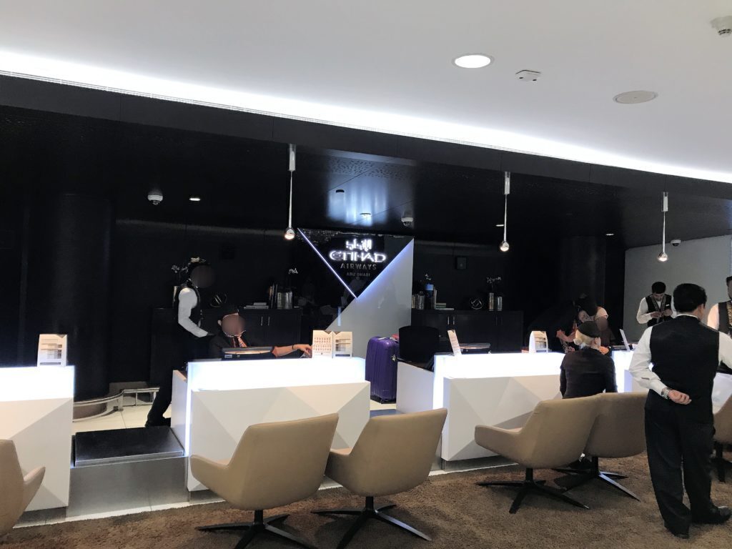 First class check in Etihad - Edited and Blurred