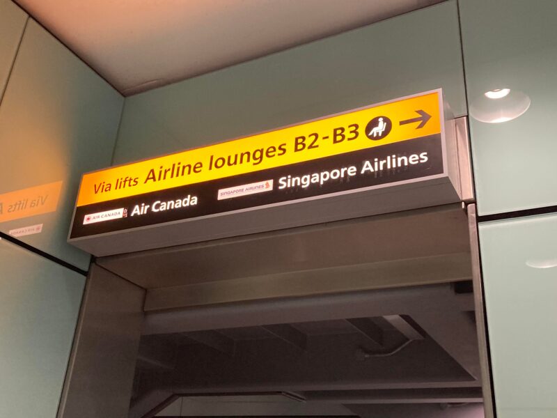 finding the air canada lounge, airport sign, heathrow terminal 2