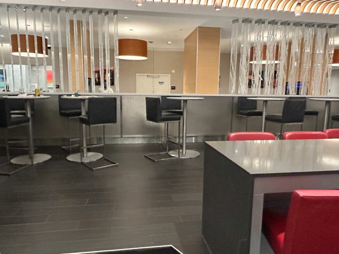 Tables for communal working at Greenwich lounge T8 New York JFK
