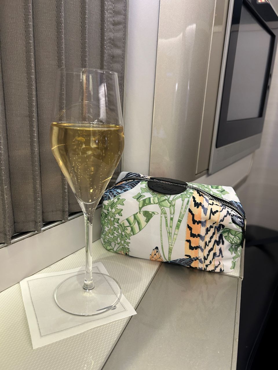 British Airways B777 First class serving of champagne