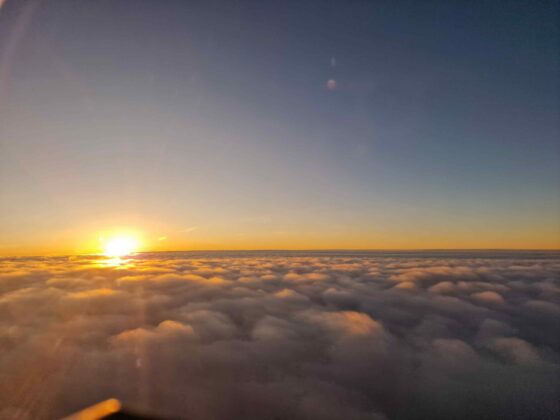 A view of a sunset over clouds