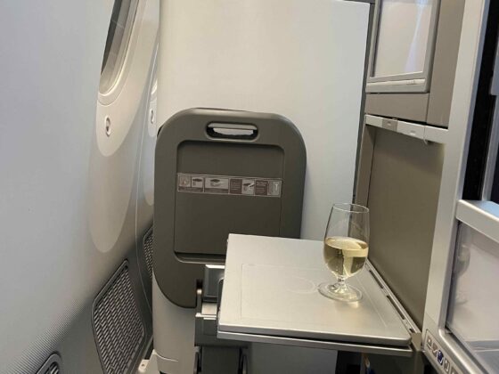 A Picture of British Airways Club World Seat B787-9 with one glass of wine