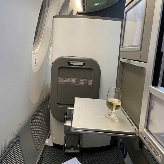 A Picture of British Airways Club World Seat B787-9 with one glass of wine