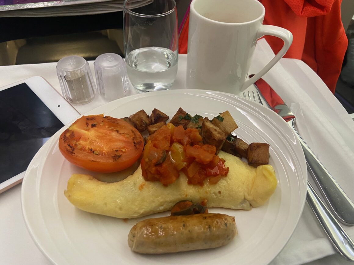 A photo of Malaysia Airlines business class Mushroom omellete and chicken sausage