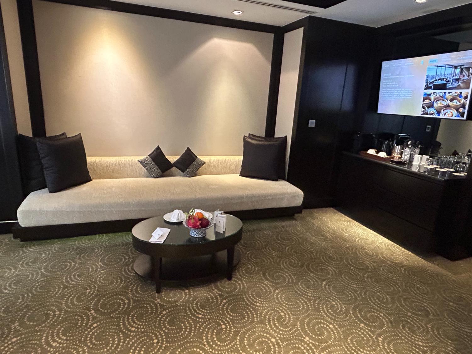 A photo Banyan Tree Hotel Bangkok Living Area with wide screen Smart TV and couch